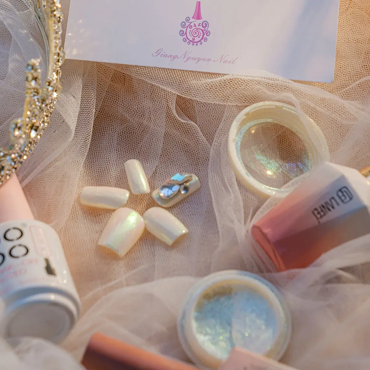 A custom press-on nail set arranged with nail-art supplies